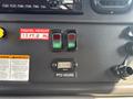 Control panel of a 2019 Freightliner M2 106 featuring buttons for PTO and stress operations along with a digital display showing PTO hours at 15082