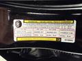 A 2019 Jeep Grand Cherokee with a label displaying tire information and specifications including sizes and load capacity