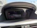 Dashboard display of a 2004 BMW 6-Series showing radio station tuned to Z95.3 with various buttons and controls visible
