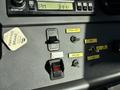 Dashboard of a 2005 Freightliner M2 106 showing various control switches and indicators including engine brake and light controls