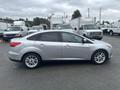 A silver 2018 Ford Focus parked with a sleek profile showcasing its compact design and alloy wheels