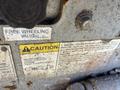 A close-up image of a caution sticker on a 2010 SkyJack SJ with instructions for towing and proper safety measures for operating the equipment