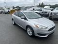 A silver 2018 Ford Focus with a sleek design and alloy wheels parked on asphalt