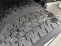 Close-up of a treaded tire from a 2021 Freightliner M2 106 showcasing detailed patterns and visible wear on the rubber surface