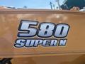 A close-up of the emblem on a 2016 Case 580 Super N featuring the numbers 580 and the text SUPER N in bold font