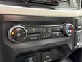 Control panel of a 2021 Ford F-150 featuring climate control knobs and buttons for air conditioning and ventilation settings