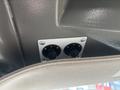 Two control knobs mounted on a panel inside a 2020 Chevrolet Express van