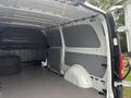 Interior view of a 2021 Mercedes-Benz Metris cargo van showing spacious, empty cargo area with gray paneling and no cargo visible