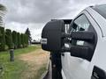 A 2023 Ford F-450 Super Duty truck with side mirrors prominently displayed in the foreground