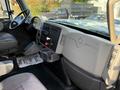 Interior view of a 2011 International 7500 showing the driver's side dashboard with controls and a gear shift area