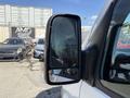 A 2016 Mercedes-Benz Sprinter van featuring a large side mirror with a sleek design and a reflective surface