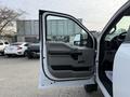 A 2020 Ford F-550 with its driver's side door open showcasing the interior door panel and seat