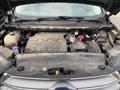 A 2017 Ford Edge engine with visible components including the air filter battery and various hoses showing dust and dirt