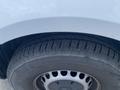 Close-up of a tire from a 2022 Mercedes-Benz Sprinter showcasing the tread pattern and rim design