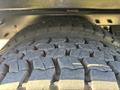 Close-up of a 2013 International 7500 truck tire showing the tread pattern and texture of the rubber