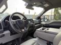 Interior view of a 2020 Ford F-550 showing the steering wheel dashboard and center console