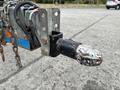 A close-up of a 2016 Genie TZ-34/20 tow hitch with visible wear featuring a metal coupling and attached wires