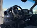 Interior view of a 2020 Mercedes-Benz Sprinter showing the steering wheel dashboard and center console with various controls and a screen