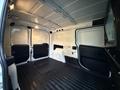 Interior of a 2017 RAM ProMaster City van with a spacious cargo area featuring a flat floor and dual rear doors opened inward