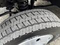 Close-up of a tire from a 2012 Ford F-550 showing tread patterns and details of the rubber surface
