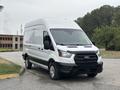 A 2020 Ford Transit 250 van in white with a black grille and wheels parked at an angle