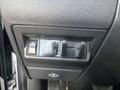 Close-up of the control panel in a 2012 RAM 2500 showing buttons and a digital display for adjusting functions