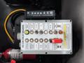 Control panel for a 2016 Peterbilt 348 featuring numerous switches and circuit breakers labeled for various functions including power take-off and hydraulic systems