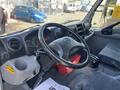 Interior view of a 2018 Hino 195 featuring a steering wheel dashboard and controls