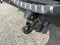 Close-up view of the hitch assembly on a 1996 Kenworth T800 featuring a heavy-duty coupling with visible bolts and a greased surface