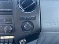 Interior dashboard controls of a 2011 Ford F-550 featuring dials for air conditioning and a 12V power outlet