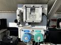 A Civacon ROM III model 3202 control panel with various gauges and switches including an optic sensor and a thermistor connected to a 2013 Kenworth T370