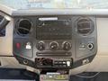 Dashboard of a 2008 Ford F-450 SD featuring climate controls audio system and various buttons for vehicle functions