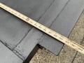 A 2015 Hino 195 truck with a measuring tape placed across a flat black surface indicating measurements