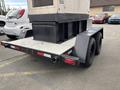 A 2005 Katolight SED60FPJ4 generator mounted on a dual-axle trailer with a flatbed design and rear lights