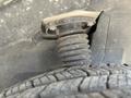 Close-up of a rubber suspension mount attached to a tire on a 2022 Mercedes-Benz Sprinter