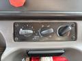 Control panel with five knobs for adjusting temperature and airflow in a 2016 Freightliner M2 106 truck
