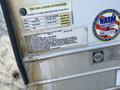 Label on a 2008 Wells Industries Inc EW1422 trailer showing tire and loading information including weight limits and tire pressure specifications