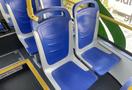 Interior of a 2017 Grande West Vicinity bus featuring blue plastic seats arranged in pairs