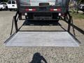 A 2019 Ford F-550 with a lowered hydraulic lift gate extending from the rear of the truck