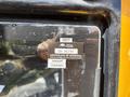 A close-up of a certification label on a 2011 Freightliner B2 showing the approval number and expiration details