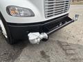 A 2006 Freightliner M2 106 truck with a visible front bumper and air intake system in the foreground