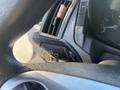 A close-up view of a turn signal lever inside a 2017 Ford Transit-350 showing the directional indicator controls