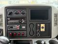 Dashboard of a 2014 International TerraStar featuring gauges for temperature and fuel, a radio unit, multiple buttons, and a panel for controls and inputs