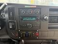 Dashboard of a 2020 Chevrolet Express featuring climate controls audio system and various buttons for vehicle functions
