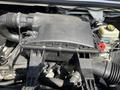 Close-up of a 2010 Mercedes-Benz Sprinter engine compartment showing the air intake system and various engine components