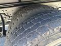 Close-up of two heavy-duty tires with deep treads mounted on a 2018 International DuraStar truck axle