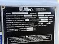 A metal nameplate showing specifications for an Altec model AM50E, including capacity, number of platforms, and operating temperature range