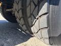 Close-up of a tire on a 2005 Freightliner M2 106 showcasing its tread pattern and rubber surface details