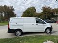 A white 2019 Mercedes-Benz Metris van parked with a sleek design and an unadorned exterior showcasing its commercial use