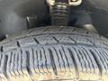 Close-up of a tire from a 2019 Mercedes-Benz Sprinter highlighting the tread pattern and rubber texture